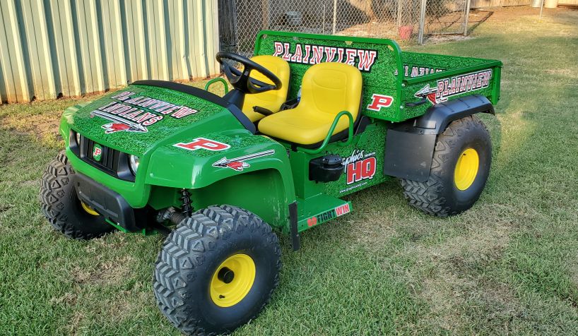 We decked out the John Deere Gator used on the football field with turf and logos.