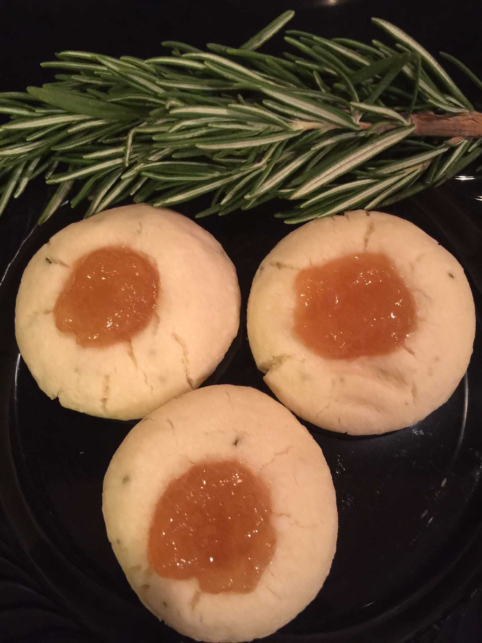 Buttery Shortbread cookie filled with pear preserves with a hint of rosemary